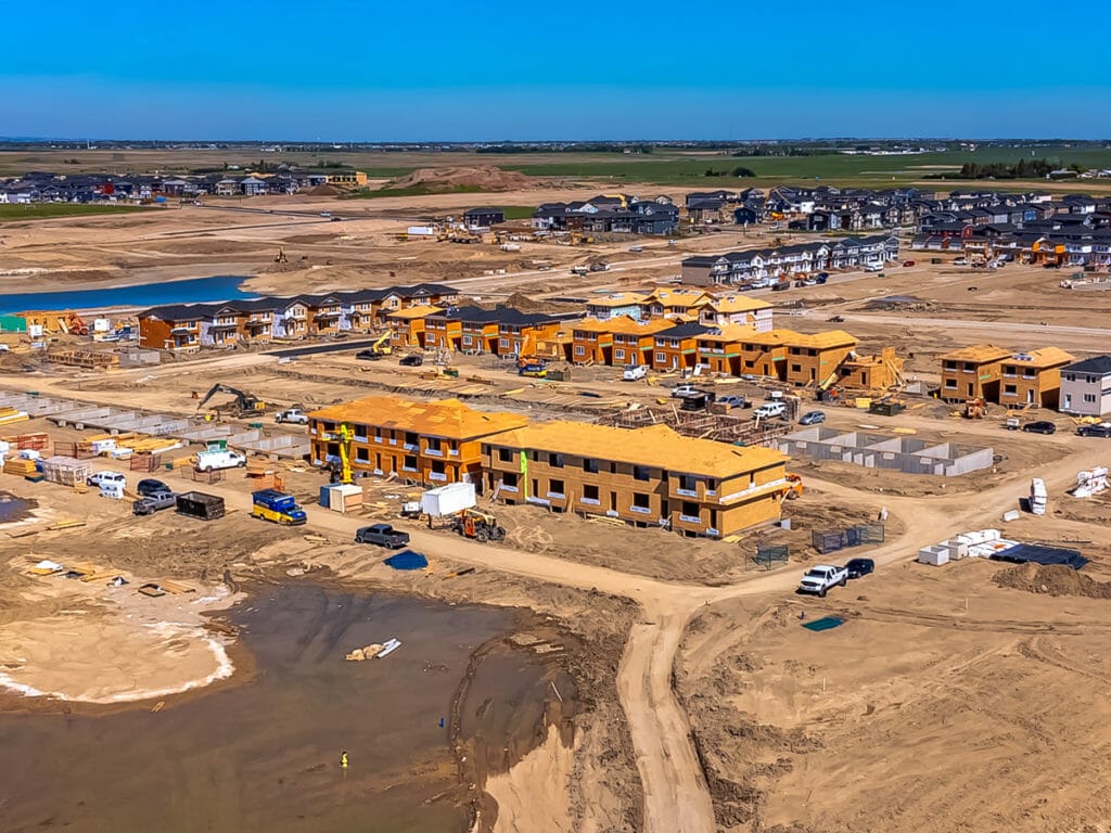 Aerial image of active home building in a new community