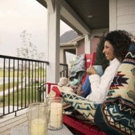 Women enjoying coffee on her front porch