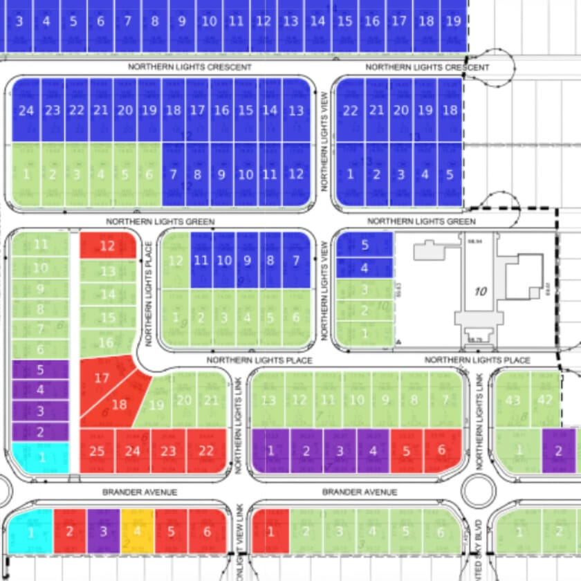 A detailed plot map showing lots in a residential community layout with labeled streets and color-coded sections